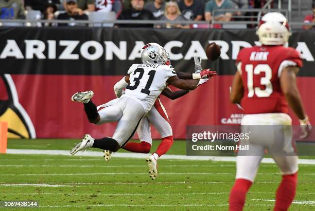 Marcus Gilchrist of the Oakland Raiders breaks up a pass against the Arizona Cardinals at State Farm Stadium on November 18, 2018 in Glendale,...