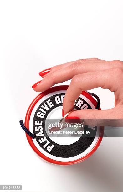 coin being donated in charity box - donation box white background stock pictures, royalty-free photos & images