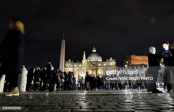 People in Saint Peter's square at the Vatican after the sand nativity scene was unveiled on December 7, 2018. - The Nativity Scene of the Vatican...