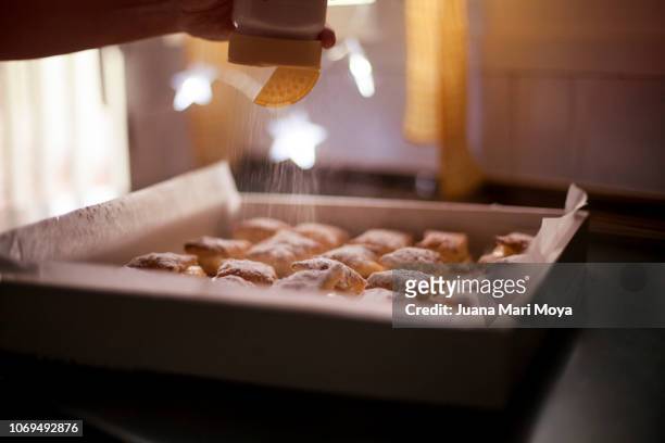 decorating typical christmas sweets, in spain - polvorón stock pictures, royalty-free photos & images
