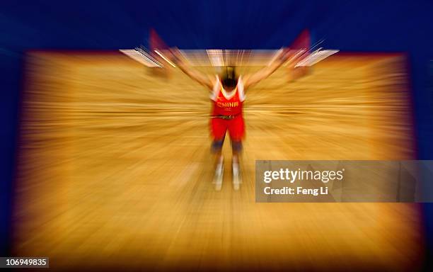 Cao Lei of China competes in the weightlifting Women's 75 kg Group A during day six of the 16th Asian Games Guangzhou 2010 at Dongguan Gymnasium on...