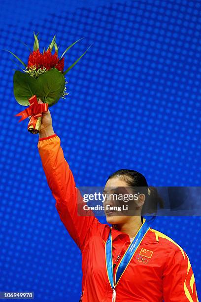 Cao Lei of China celebrates winning the silver medal in the weightlifting Women's 75 kg Group A during day six of the 16th Asian Games Guangzhou 2010...