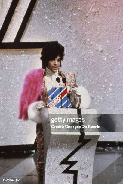 American singer, songwriter and musician Prince collects the award for Best International Artist at the British Record Industry Awards, aka the BRIT...