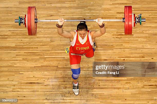 Cao Lei of China competes in the weightlifting Women's 75 kg Group A during day six of the 16th Asian Games Guangzhou 2010 at Dongguan Gymnasium on...