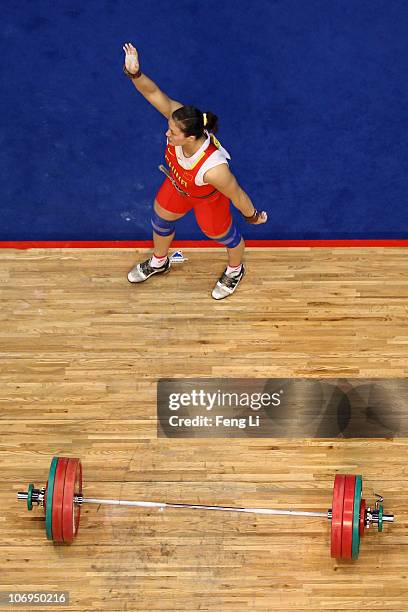 Cao Lei of China celebrates winning the silver medal in the weightlifting Women's 75 kg Group A during day six of the 16th Asian Games Guangzhou 2010...