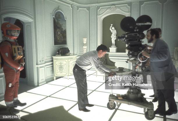John Alcott adjusts the camera position whilst film director and screenwriter Stanley Kubrick finds his shot on the set of '2001: A Space Odyssey' at...
