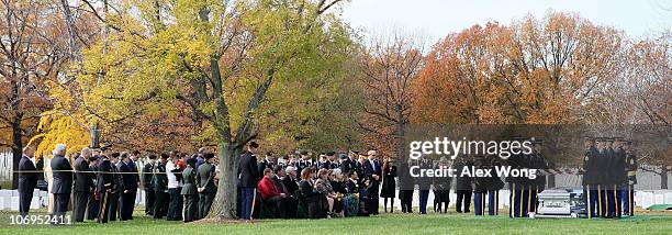 Friends and family members attend a group burial service for Army Staff Sergeant Luis M. Gonzalez of South Ozone Park, New York; Sergeant Fernando...