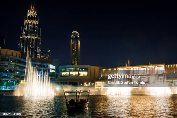 dubai fountain show at night - dubai fountain stock pictures, royalty-free photos & images