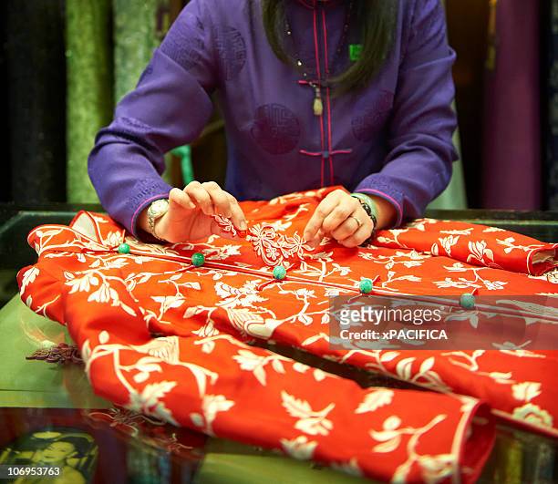tailor working on garment - silk china stock pictures, royalty-free photos & images