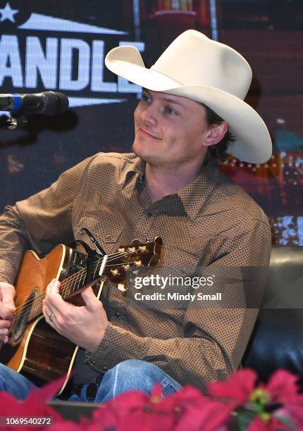 Ned LeDoux performs onstage during the "Outside the Barrel" with Flint Rasmussen show during the National Finals Rodeo's Cowboy Christmas at the Las...