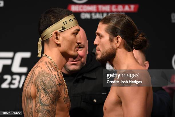 Opponents Max Holloway and Brian Ortega face-off during the UFC 231 weigh-in at Scotiabank Arena on December 7, 2018 in Toronto, Canada.