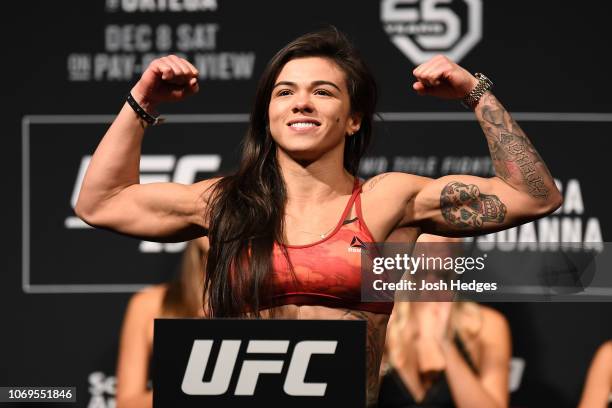 Claudia Gadelha of Brazil poses on the scale during the UFC 231 weigh-in at Scotiabank Arena on December 7, 2018 in Toronto, Canada.