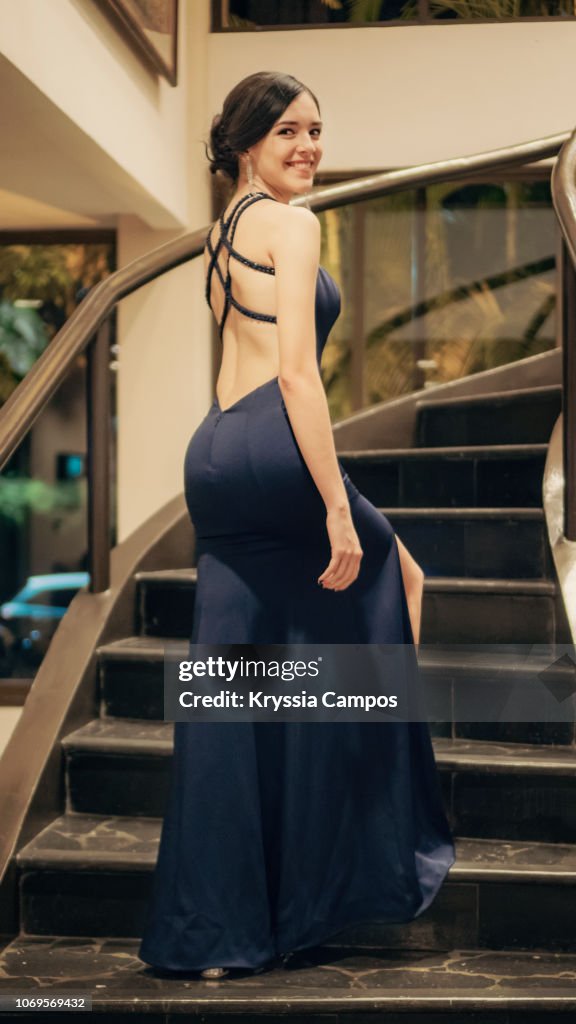 Portrait of a Teenage Girl Wearing a Evening Gown in Staircases