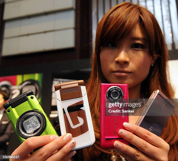 Model displays new mobile series of NEC CASIO Mobile Communications, Ltd., during the press preview on November 18, 2010 in Tokyo, Japan. NEC CASIO...