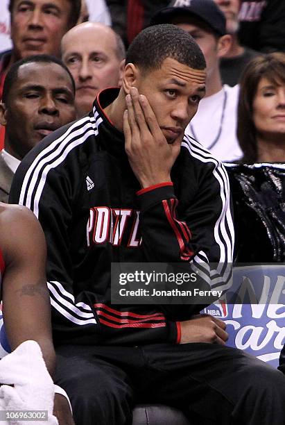 Injured guard Brandon Roy of the Portland Trail Blazers sits on the bench against the Denver Nuggets on November 18, 2010 at the Rose Garden in...