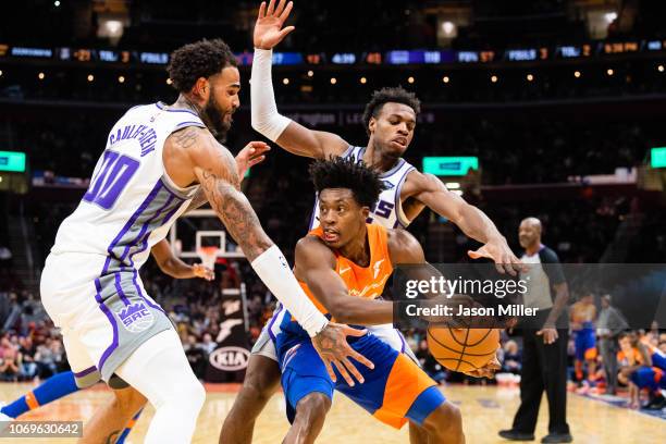 Willie Cauley-Stein and Buddy Hield of the Sacramento Kings double team Collin Sexton of the Cleveland Cavaliers during the second half at Quicken...