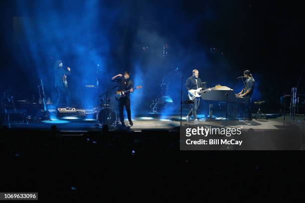 Winston Marshall, Marcus Mumford, Ted Dwane and Ben Lovett of the band Mumford and Sons perform at the Wells Fargo Center December 7, 2018 in...