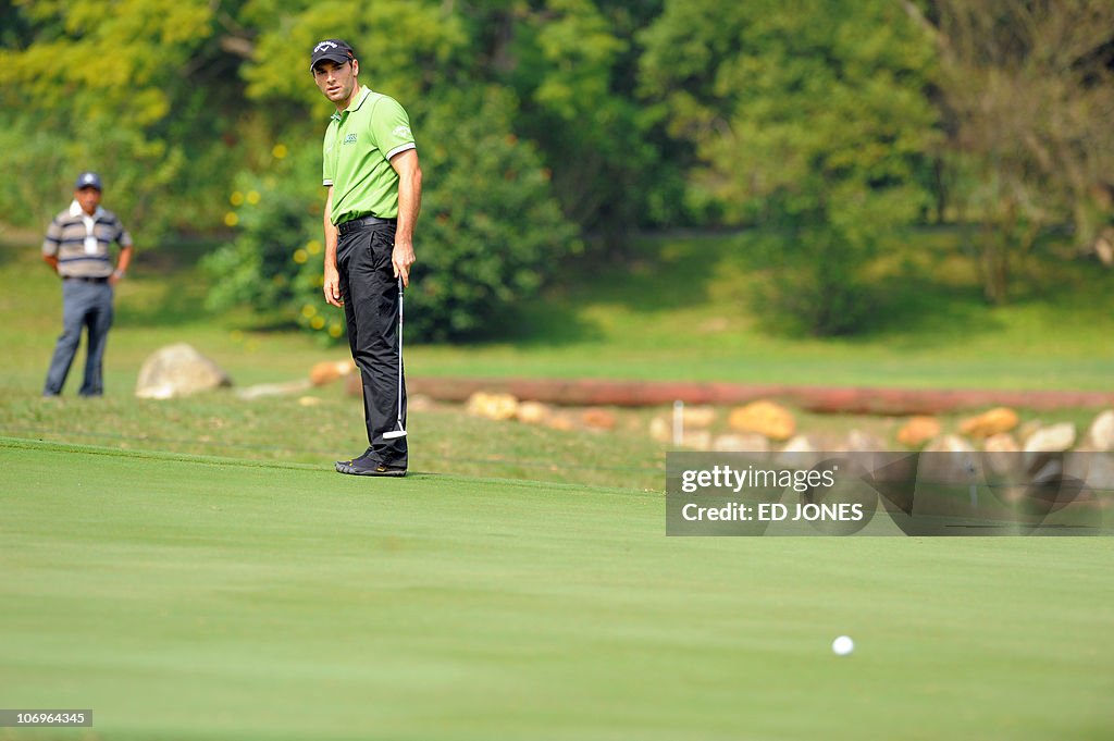 Oliver Wilson of England watches his put