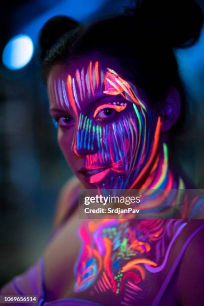 carnevale al neon - luce fluorescente foto e immagini stock