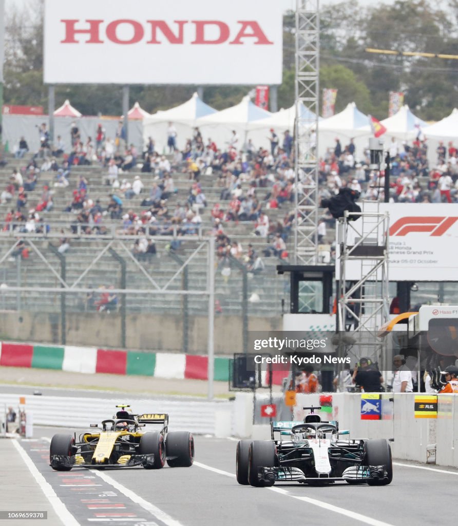 Japanese F1 Racers Formula One racers drive during a practice session for the Japanese ...
