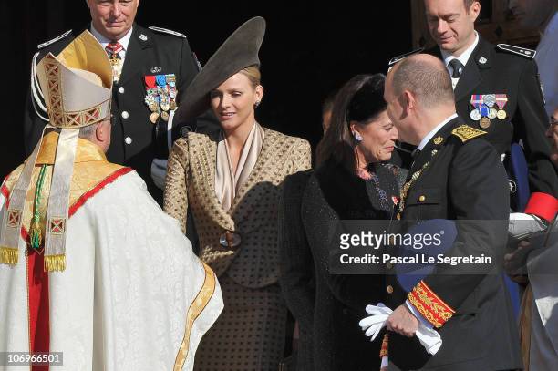 Monaco's Archbishop Bernard Barsi, Charlene Wittstock, princess Caroline of Hanover and Prince Albert II of Monaco leave the Cathedral after they...