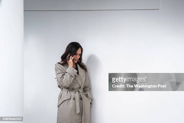 Stephanie Grisham, Press Secretary and Communications Director for the First Lady Melania Trump, talks on the phone before President Donald J. Trump...