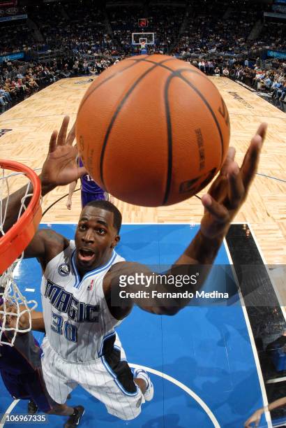 Brandon Bass of the Orlando Magic grabs a rebound against the Phoenix Suns on November 18, 2010 at the Amway Center in Orlando, Florida. NOTE TO...