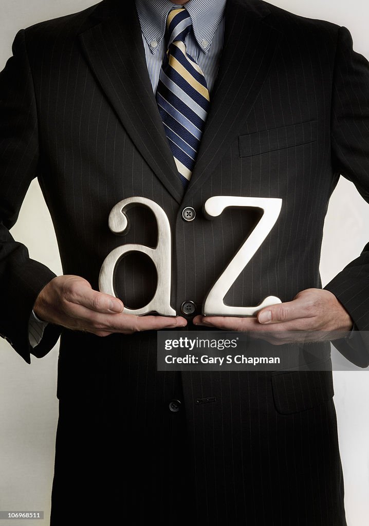 Businessman with A to Z letters