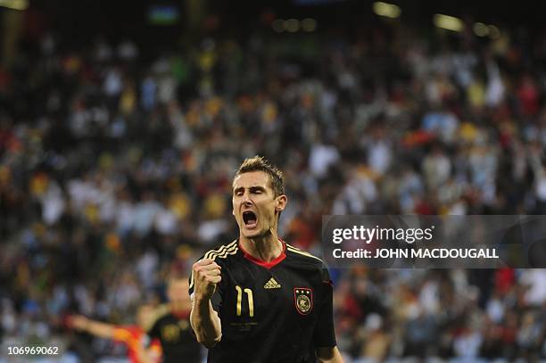 Germany's striker Miroslav Klose celebrates after scoring his team's fourth goal during the 2010 World Cup quarter-final football match Argentina vs....