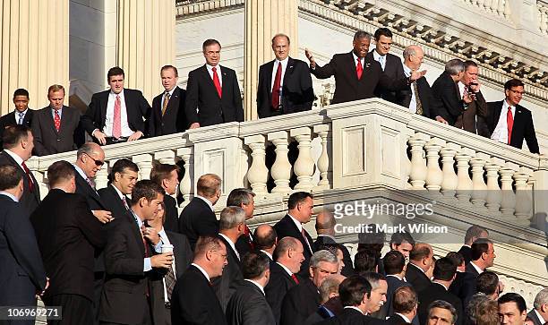 Newly elected freshman members of the upcoming 112th Congress gather after posing for a class photo on the steps of the U.S. Capitol on November 19,...