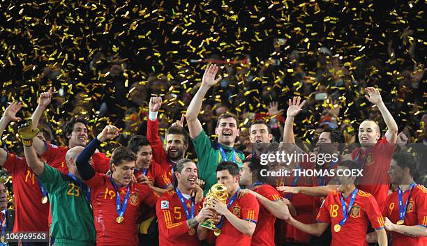 Spain's striker David Villa kisses the trophy during the award ceremony following the 2010 FIFA football World Cup between the Netherlands and Spain...