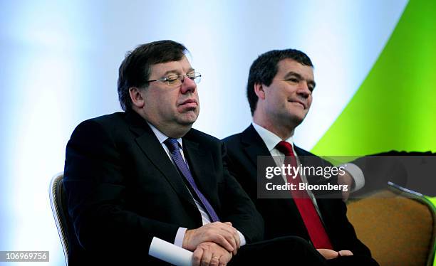 Brian Cowen, Ireland's prime minister, left, sits with Noel Dempsey, Ireland's transport minister, during a news conference at Dublin airport's...