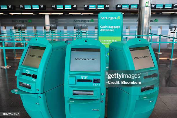 Aer Lingus Group Plc self check-in machine's sit at Dublin airport's Terminal 2 building, in Dublin, Ireland, on Friday, Nov. 19, 2010. Ryanair...