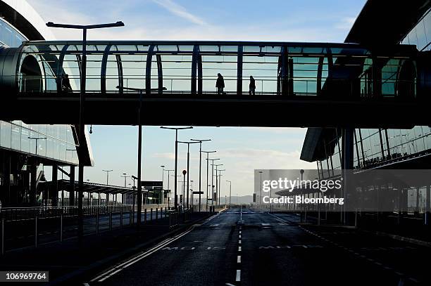 Visitor's use a walkway at Dublin airport's Terminal 2, in Dublin, Ireland, on Friday, Nov. 19, 2010. The Dublin Airport Authority said two days ago...
