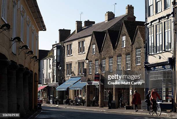 People browse the shops along Tetbury high street on November 19, 2010 in Tetbury, England. The Gloucestershire town is close to Highgrove, The...