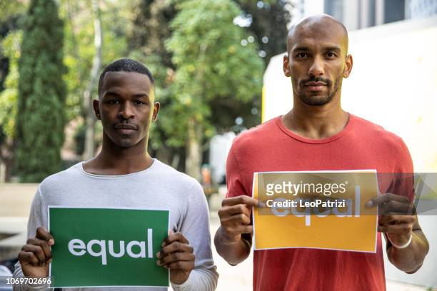 gay men couple spending time together in los angeles - black civil rights stock pictures, royalty-free photos & images