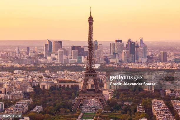 paris skyline at sunset with eiffel tower and la defense business district, paris, france - la tour eiffel stock pictures, royalty-free photos & images