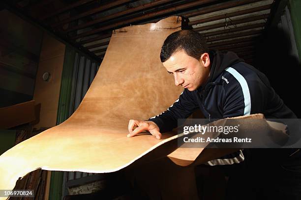 Student Hasan Sari controlls the dry and finished sole leather at the LGR tannery school on November 17, 2010 in Reutlingen, Germany. Sole leather...