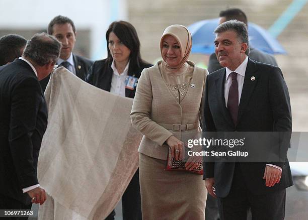 Turkish President Abdullah Gul and his wife Hayrunnisa Gul arrive on the first day of the NATO Summit at Feira Internacional de Lisboa on November...