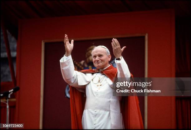 Pope John Paul II raises his arms in greeting after his speech at Chapel of St Patrick's College, Maynooth, Ireland, October 1, 1979.