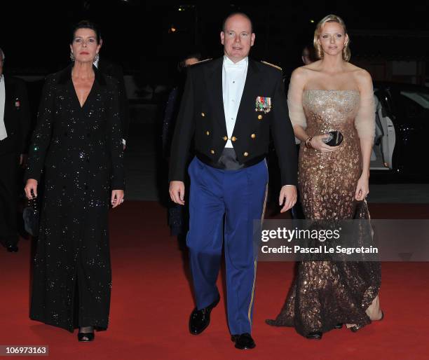 Princess Caroline of Hanover, Prince Albert II of Monaco and Charlene Wittstock arrive to attend the Monaco National day Gala concert at Grimaldi...