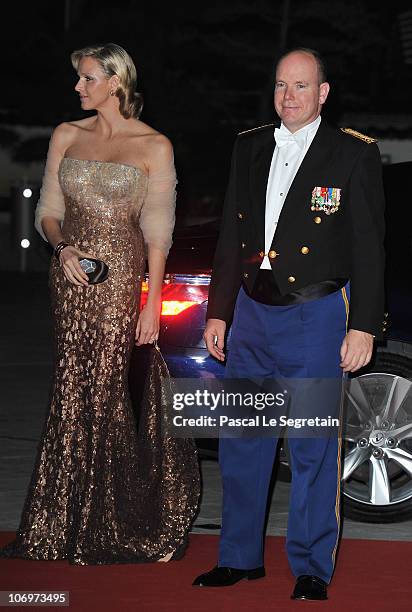 Prince Albert II of Monaco and Charlene Wittstock arrive to attend the Monaco National day Gala concert at Grimaldi forum on November 19, 2010 in...