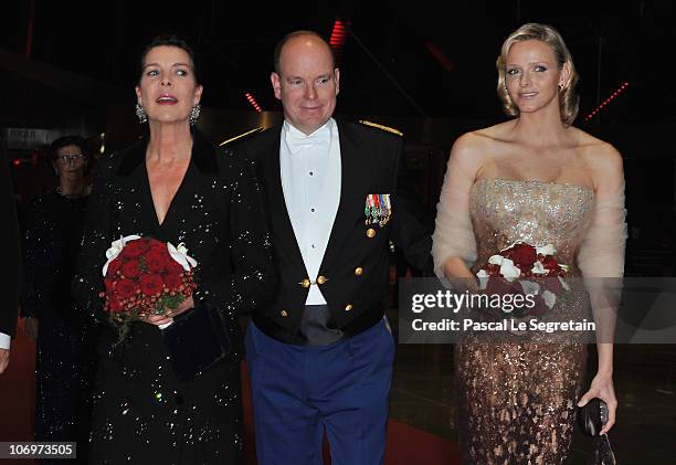 Princess Caroline of Hanover, Prince Albert II of Monaco and Charlene Wittstock arrive to attend the Monaco National day Gala concert at Grimaldi...