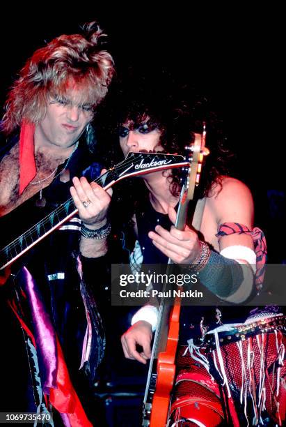 Robbin Crosby , left, and Warren DeMartini of Ratt perform on stage at the Milwaukee Arena in Milwaukee, Wisconsin, November 5, 1984.