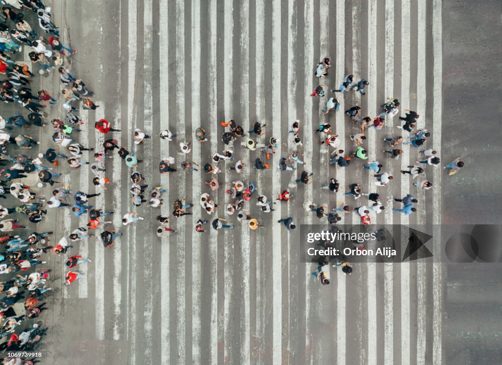 High Angle View Of People forming and arrow on the street