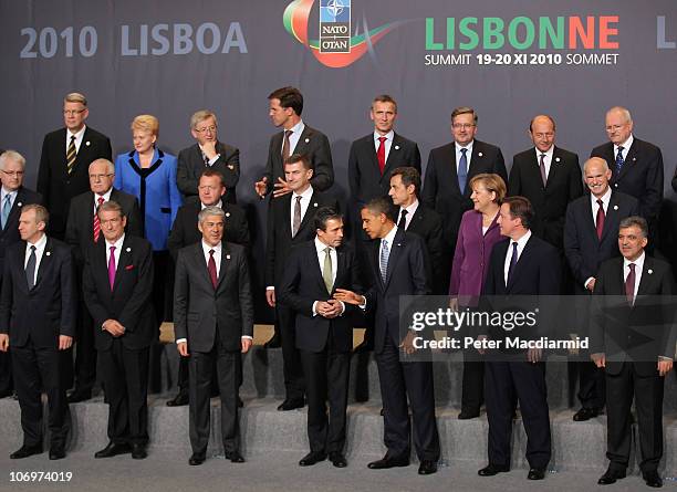 Heads of state of the nations of Nato stand together for the official family photo of the NATO Summit 2010 at Feira Internacional de Lisboa on...