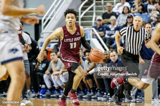 Jaizec Lottie of the Arkansas Little Rock Trojans moves the ball down the court during the game between the Nevada Wolf Pack and the Arkansas Little...