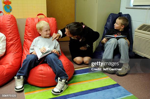 Jennifer Garner works with students during the launch of six new Save the Children U.S. Program sites at the Ashton Elementary School on November 19,...