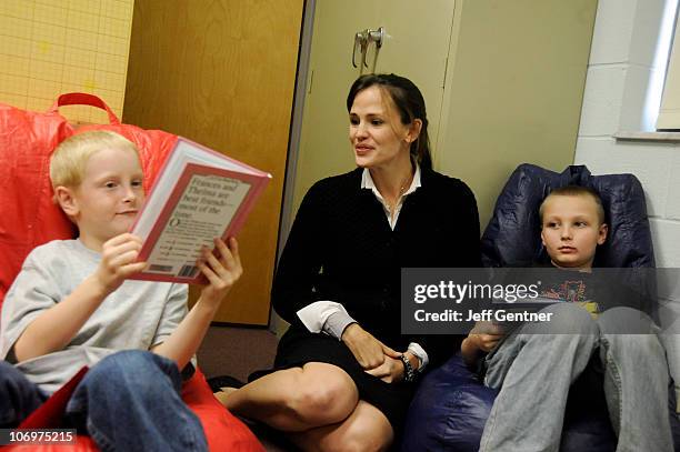 Jennifer Garner works with students during the launch of six new Save the Children U.S. Program sites at the Ashton Elementary School on November 19,...