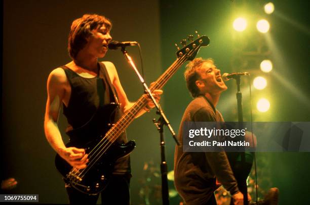 Guitarist Mike Mills, left, and singer Michael Stipe of REM perform on stage at the Carver Hawkeye Arena in Ames, Iowa, March 10, 1989.